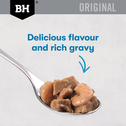 Spoonful of Black Hawk Chicken & Seafood chunks with shrimp in rich gravy